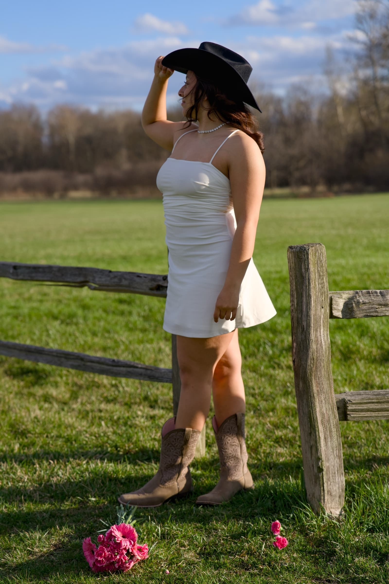 Birthday portrait in cowboy boots at golden hour